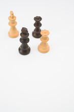 Vertical Shot Of Black White Chess Pieces Isolated On A White Background