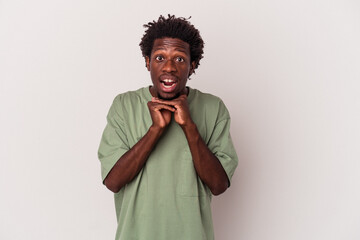 Wall Mural - Young african american man isolated on white background  praying for luck, amazed and opening mouth looking to front.