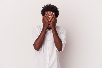 Wall Mural - Young african american man isolated on white background  having fun covering half of face with palm.