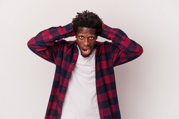 Wall Mural - Young african american man isolated on white background  screaming, very excited, passionate, satisfied with something.