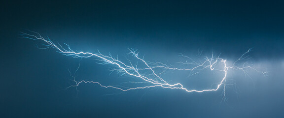 Wall Mural - forked lightning bolt high up in the sky, also known as an anvil crawler