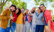 © blackandbrightph - portrait of multiethnic group of friends posing in the street outdoors laughing and having fun. diverse people celebrating life together enjoying happy holidays. lifestyle, travel and joy concept