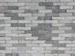 masonry of small long gray bricks of different shades. tile pattern on the roads. road surface