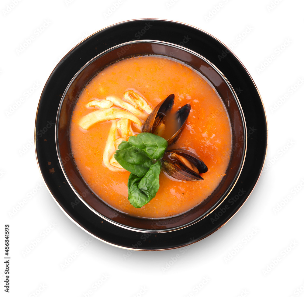 Bowl of tasty Cacciucco soup on white background