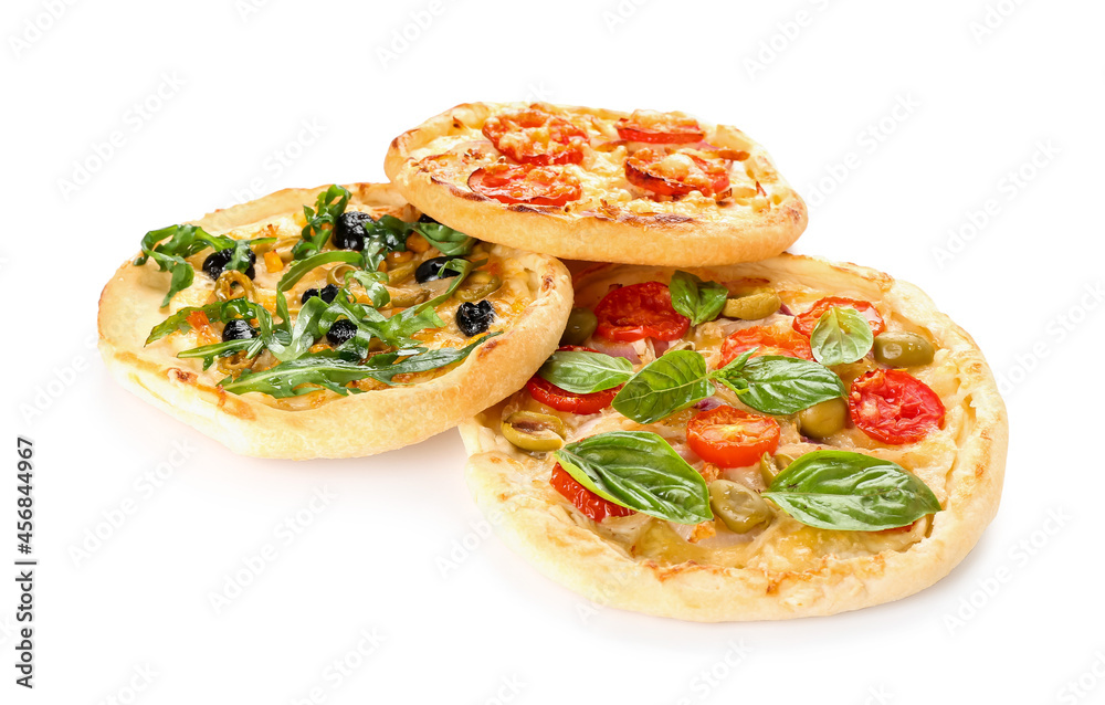 Tasty mini pizzas on white background