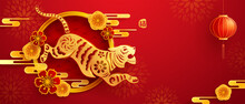 Happy Chinese New Year 2022. Year Of The Tiger. Paper Graphic Cut Art Of Golden Tiger Symbol And Floral With Oriental Festive Element Decoration On Red Background.