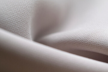 abstract texture of draped beige background. eautiful textile backdrop. Close-up. Top view. soft focus, blur