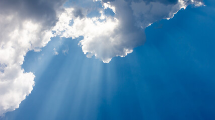 Beautiful scene rays of light and the clouds in the sky. Dramatic scene in cloudy summer.