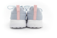 Part Of Gray Sports Sneakers With Pink Stripes On A White Background. Adidas