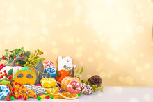 Happy Halloween Greeting Card Background. Trick Or Treat Concept. Traditional Gingerbread Cookies, Candy, Sweets, Pumpkins, Decorations With Bokeh Lights Effect