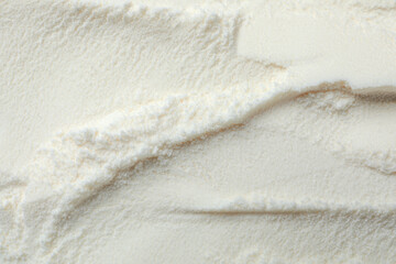 Closeup view of powdered infant formula as background. Baby milk