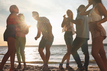 Sticker - Group of friends having fun near river at summer party