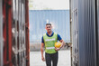 © chokniti - foreman or engineer are work in container shipping industry warehouse, logistic transport to import and export cargo at delivery storage port terminal, man are work to control a business box