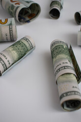 Wall Mural - Rolled dollars on a white with copy space. American money.