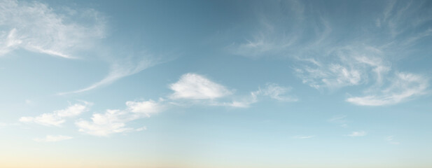 panorama of blue sky with wispy clouds