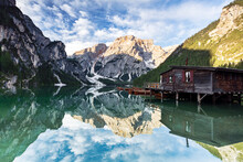Lake Braies (Pragser Wildsee) at sunrise with Croda del Becco mountain reflected in water, Dolomites, South Tyrol
