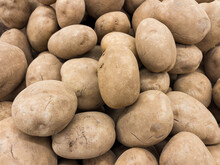 Idaho Russet Potatoes On Display At Grocery Store Market.
