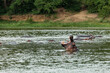© Denys - A hippo in water with its mouth wide open in Queen Elizabeth National Park, Uganda