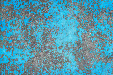 Old blue peeling paint dirty concrete wall texture with abstract grunge pattern cement background