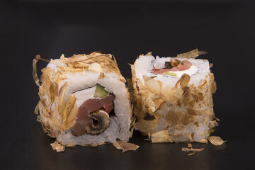 Poster - Closeup of bonito rolls on a black backgro