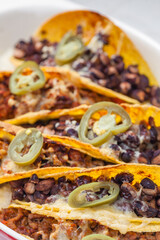 Wall Mural - tacos filled with minced meat and black beans