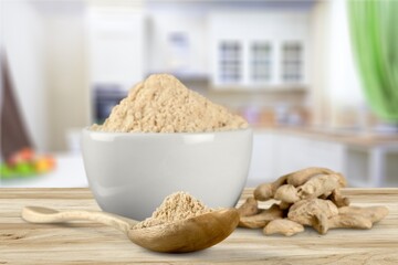 Poster - Turmeric powder in the bowl and root on the desk