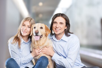 Canvas Print - Love And Care Concept. Portrait of cheerful couple patting their dog