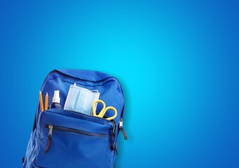 Poster - School backpack with different colorful stationery products on desk