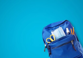 Poster - School backpack with different colorful stationery products on desk