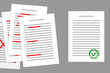 Stack of papers with red corrections, and final corrected document