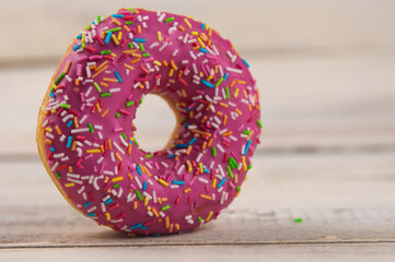 Poster - raspberry donuts on a wooden table