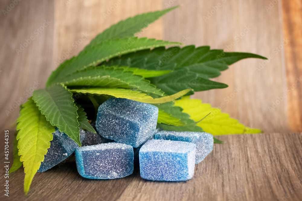 Blue Raspberry Delta-8 Gummies with Hemp Leaves Stock Photo | Adobe Stock