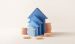 Blue up arrow and coin stacks on pastel background. Financial success and growth concept. copy space, 3d rendering