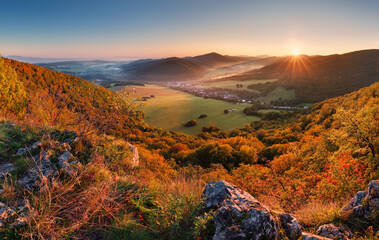 Wall Mural - autumn mountain panorama with golden forest and village in slovakia