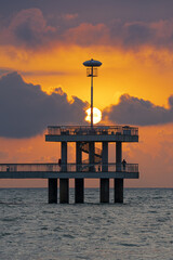 Canvas Print - Vertical shot of Burgas Bridge next to sea garden with sunset background in Burgas, Bulgaria