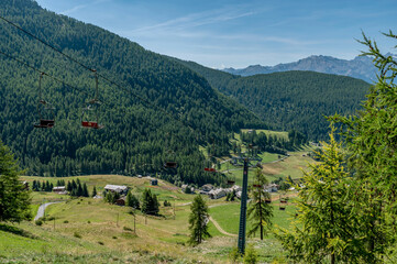 Wall Mural - The chairlift that connects Chamois with Lake Lod, Aosta Valley, Italy, in the summer season