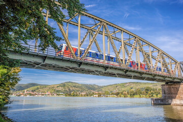 Wall Mural - Train on bridge against Krems town in Wachau valley, Unesco world heritage site in Lower Austria, Austria