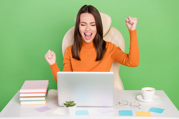 Wall Mural - Portrait of pretty lucky cheerful girl agent broker working remotely rejoicing breakthrough isolated over bright green color background