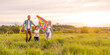 © Angelov - Happy family father, mother and child daughter launch a kite on nature at sunset