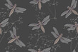Seamless monochrome pattern with insects with an embossed effect. Dragonflies and an openwork plant on a gray background.