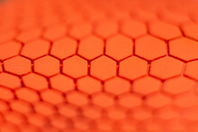 Orange Hexagon Pattern Background Is A Rubber Decorated Closeup.Orange Hexagon Abstract Background Texture.Macro Shot.Blurred Shot.