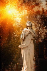 Fototapete - Antique statue  of holy Virgin Mary. Vertical image.