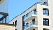 © Grand Warszawski - Modern apartment building on a sunny day. Architectural details and facade of a modern apartment building.