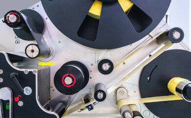 Aufkleber - Fragment of the conveyor of sticking labeling machine. Abstract industrial background.