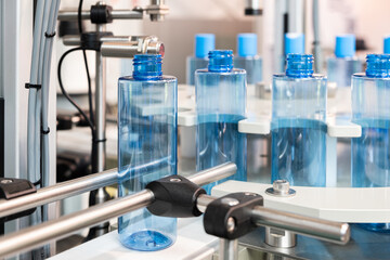 Poster - pharmaceutical industry, medicine pills are filling in the  bottle on production line machine conveyor at the medical factory. selective focus.