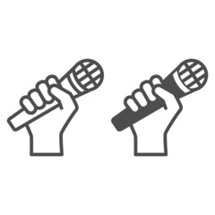 Fototapete - Microphone in hand line and solid icon, sound design concept, hand holding mic vector sign on white background, outline style icon for mobile concept and web design. Vector graphics.