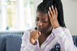 Teenage Girl Suffering With Cough At Home