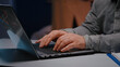 © DC Studio - Close-up of businessman hands on keyboard sitting at desk table in startup company office browsing economic ideas on internet. Entrepreneur typing financial statistics answering business email