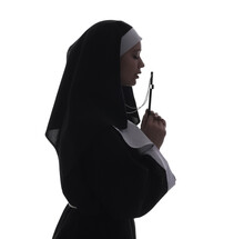 Silhouette Of Young Nun With Cross On White Background