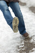 Closeup Woman is slipping and falling on a icy street